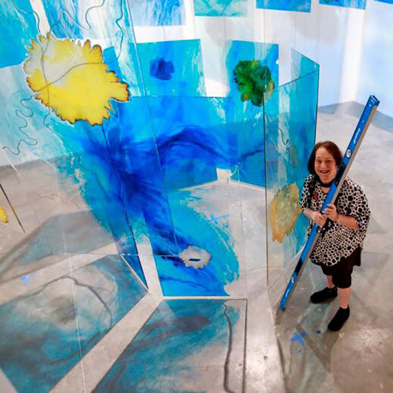 Artist Mira Lehr with her artwork